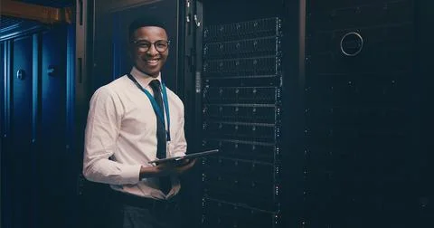Engineer, black man and portrait with tablet in server room for inspection Stock Photos
