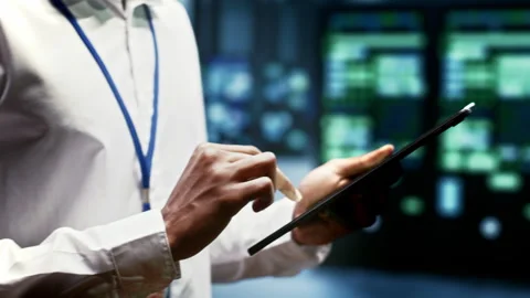 Engineer in blockchain server room Stock Footage 246239998