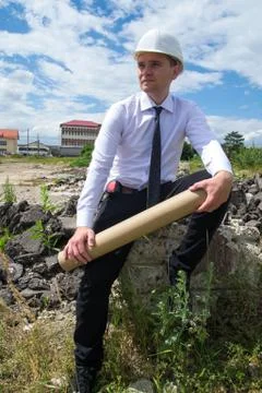 Engineer with blueprints on site Stock-Fotos