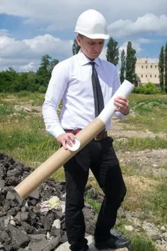 Engineer with blueprints on site Stock Photos