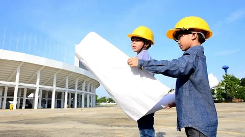 Engineer boy with yellow safety helmet at construction area Stock Footage 75819347