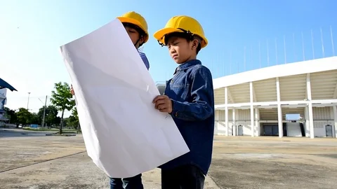Engineer boy with yellow safety helmet  Stock Footage 76972543