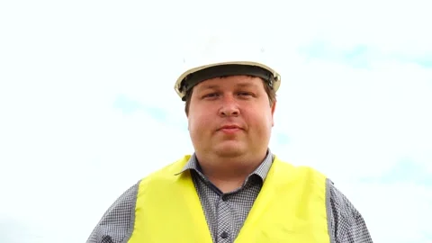 Engineer builder against cloudy background Stock Footage 111880673