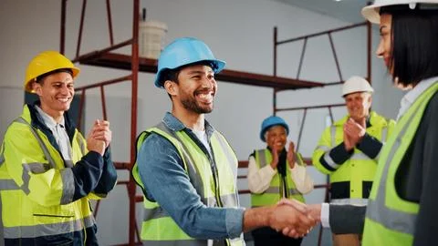 Engineer, builder and handshake on site with applause, well done and approval of Stock Photos
