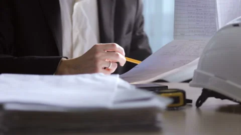 Engineer builder checks drawings Stock Footage 92094193