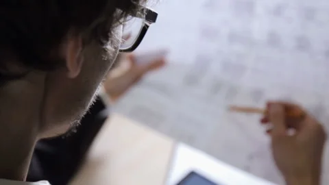 Engineer builder checks the drawings in the office Stock-Footage 85602025