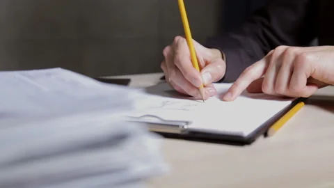 Engineer builder checks the drawings in the office Video stock 92082493