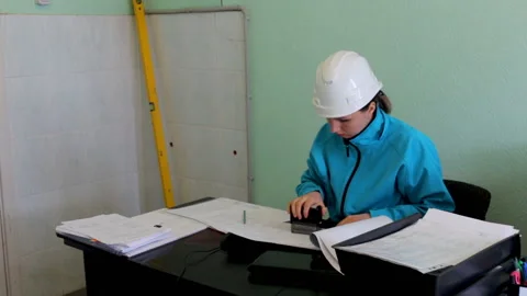 Engineer builder checks the project puts a stamp Stock Footage 89699627