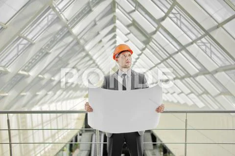 The engineer-builder watching, control process Stock Photos