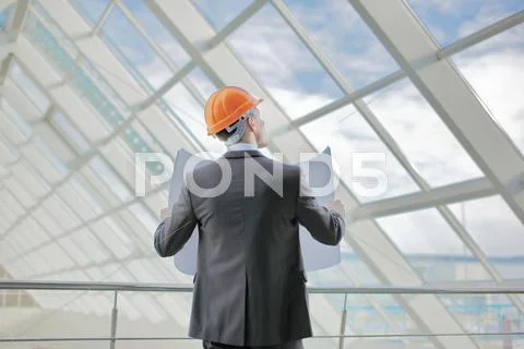 The engineer-builder watching, control process Stock Photos