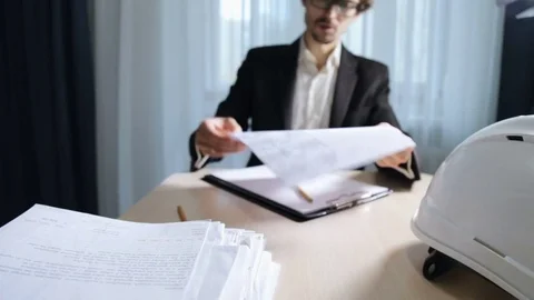 Engineer builder works with drawings Video stock 82531051