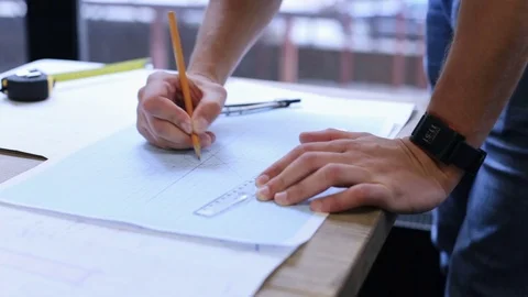 Engineer builder works with drawings in the office Stock Footage 81665921