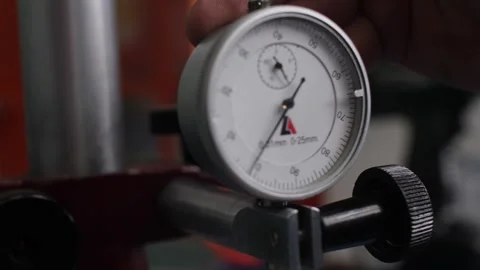 Engineer carefully adjusting dial indicator used in mechanical engineering. Video stock 313815407