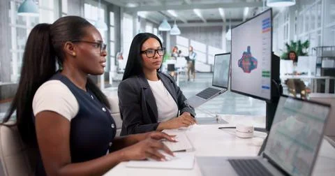 Engineer Carefully Designs 3D Product On Laptop Using Advanced CAD Software. Stock Photos