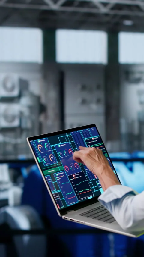 Engineer Carefully Inspects Power Plant Engine Using Laptop Stock Footage 336795279
