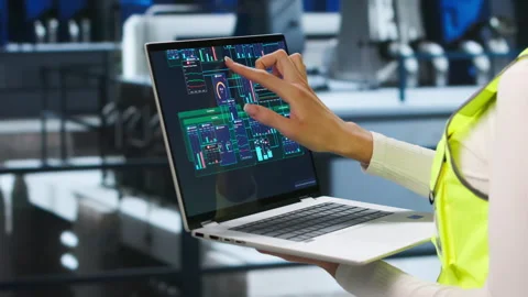 Engineer Carefully Inspects Power Plant Engine Using Laptop Stock Footage 343889471