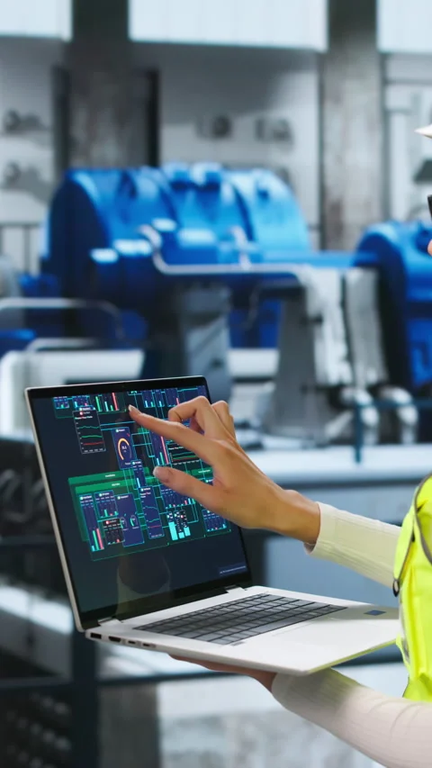 Engineer Carefully Inspects Power Plant Engine Using Laptop Stock Footage 345331244