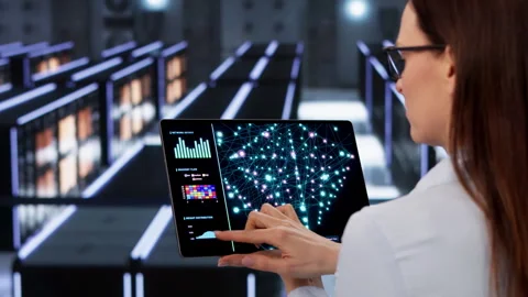 Engineer Carefully Monitors AI Training Stock Footage 330588165