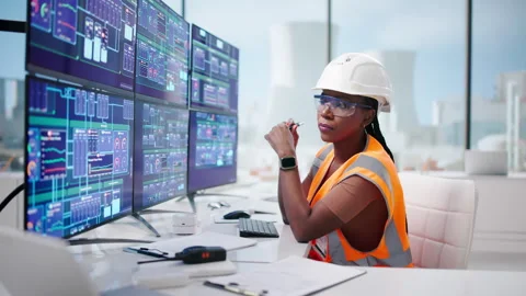 Engineer Carefully Monitors SCADA System Stock Footage 337643319