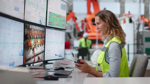 Engineer Carefully Operates Robotic Arms Remotely Using Haptic Controllers Stock Footage 337631264