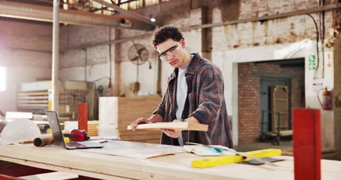 Engineer, carpenter and man with plank in workshop for project, planning and Stock Footage 340614987