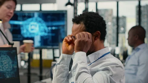 Engineer chatting with manager in office, laughing while using AI Stock Footage 323143462