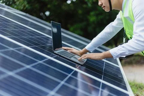 Engineer check data from the sensor of solar cells panel Stock Photos