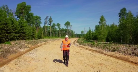 Engineer check new forest road Stock Footage 90415936