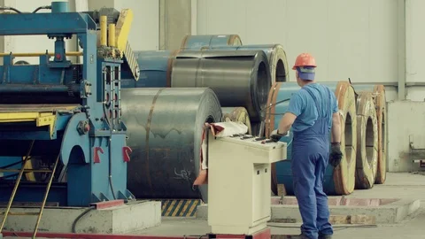 Engineer checking and controlling automatic machine in mechanical workshop Stock Footage 121190843