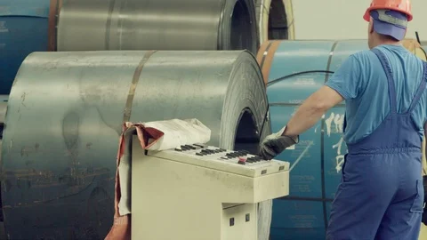 Engineer checking and controlling automatic machine in mechanical workshop Stock Footage 121190938