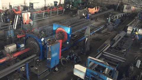 Engineer checking and controlling welding automatic machine in mechanical worksh Stock Footage 121189453