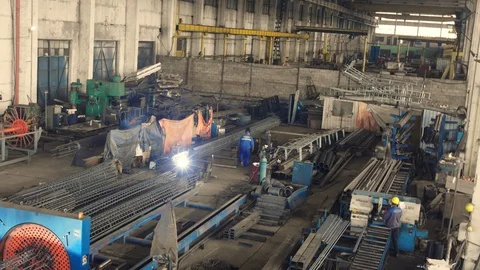 Engineer checking and controlling welding automatic machine in mechanical worksh Stock Footage 121189699