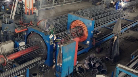 Engineer checking and controlling welding automatic machine in mechanical worksh Stock Footage 121189875