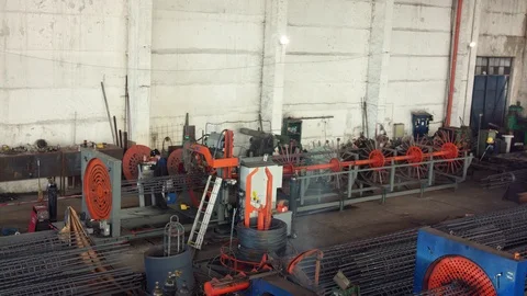 Engineer checking and controlling welding automatic machine in mechanical worksh Stock Footage 121189981