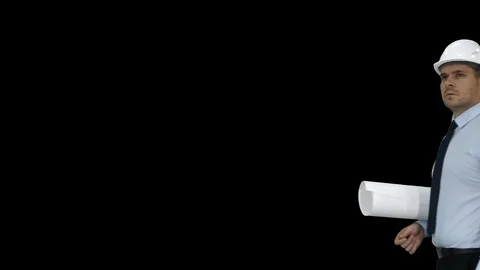 Engineer checking construction plan with what is built, Alpha Channel Stock-Footage 108948625