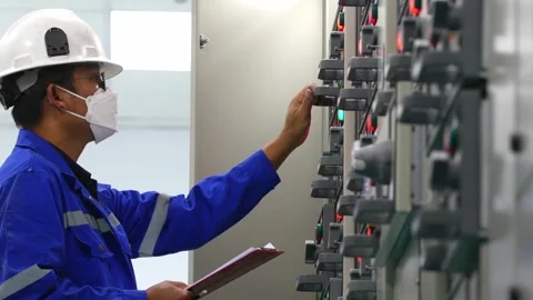 Engineer Checking Electrical Cabinets in Industrial Plant 스톡 동영상 246438008
