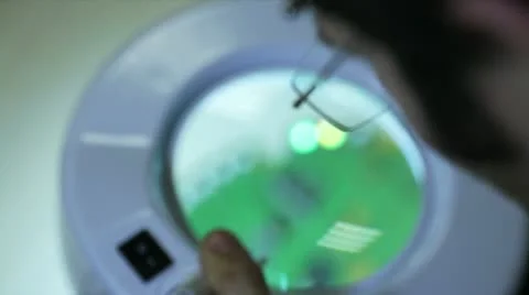Engineer checking an electronic circuit board Stock Footage 22421851