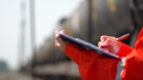 An engineer is checking heavy machine checklist form during inspecting job. Stock Footage 308180149