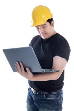 Engineer checking on production on laptop Stock Photos