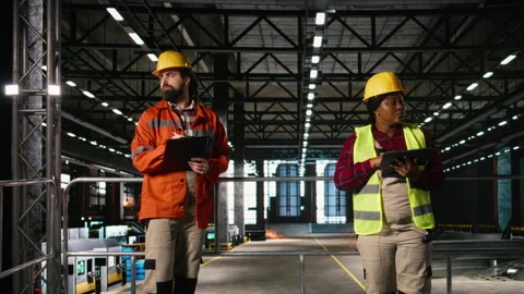Engineer checking production line on laptop in heavy industry plant Video stock 330088765