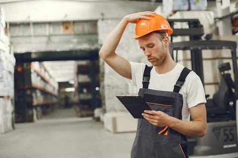 Engineer checking the products in the control room Stock Photos