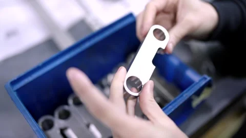 Engineer checking the quality of small metal pieces Stock Footage 261223917
