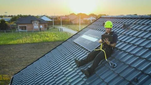 Engineer Checking Solar Panel Installation Using Tablet With Digital Animation Stock Photos