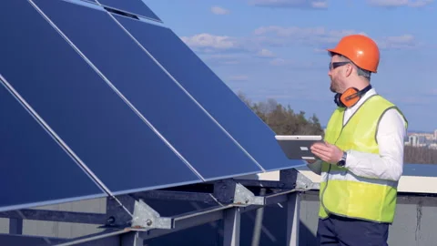 Engineer is checking solar panels. Stock Footage 89647445