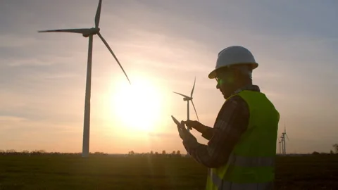 Engineer checking wind turbine system using tablet. Stock Footage 201152420