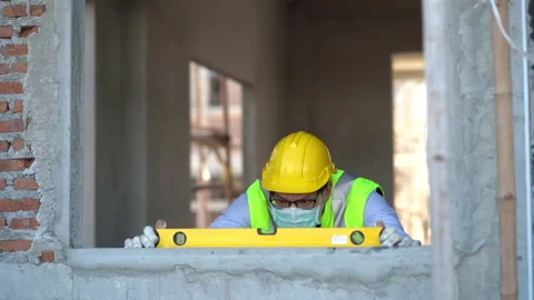 Engineer checking window with spirit level . Asain worker using water level m Stock Footage 146442078