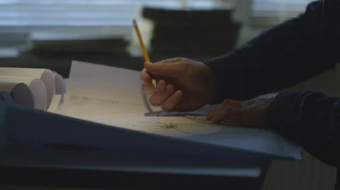 Engineer checks the construction drawings Stock Footage 58914419