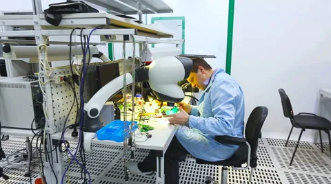 Engineer Checks Details in a Microscope Laboratory Stock Footage 60583098