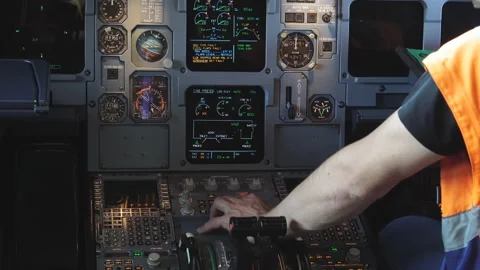 Engineer checks the electronics in a passenger plane 4K Stock Footage 95597225