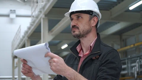 Engineer checks at the factory 스톡 동영상 128934844